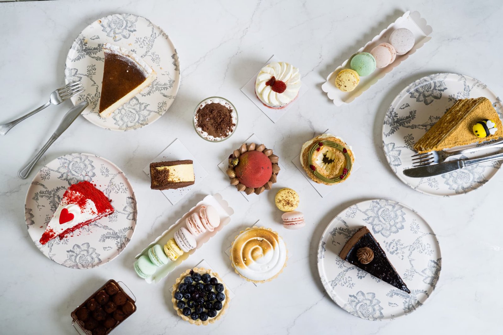 A table of handcrafted Marinos Kosmas desserts and macarons